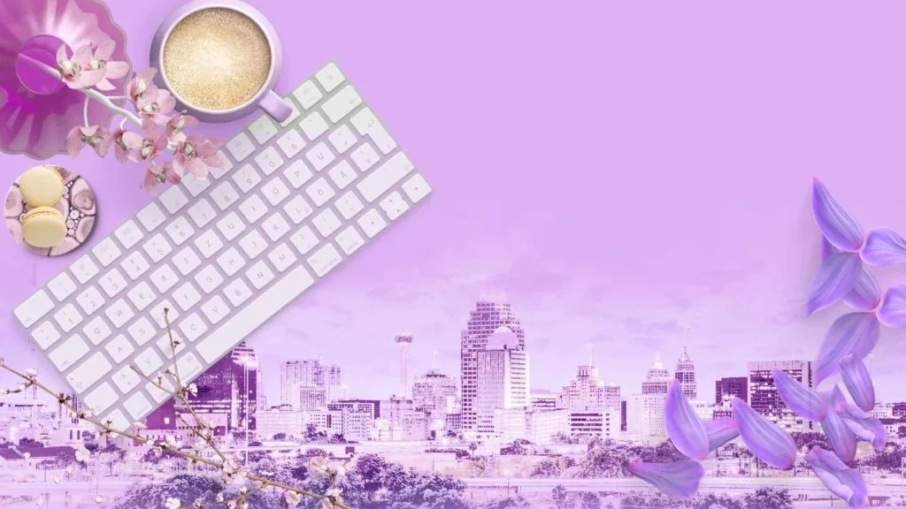 keyboard, mouse, pens, coffee, flowers, and macaroons with San Antonio Skyline